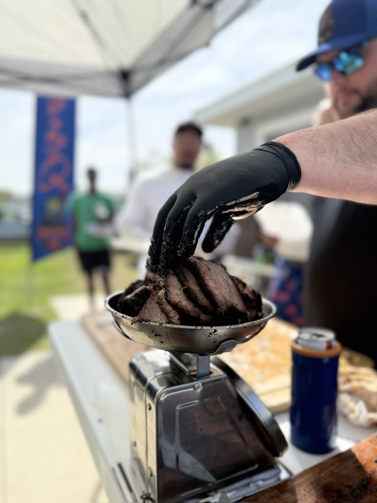 Drew preparing barbecue at the food truck