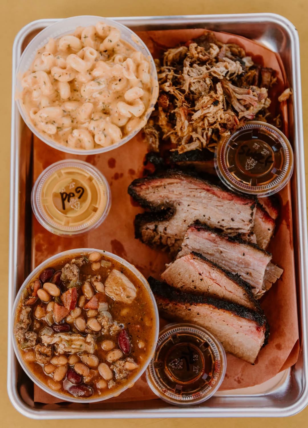 Smokey Drew’s tray with ribs, brisket, pulled pork, mac and cheese, and baked beans